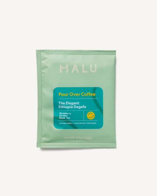 Aqua-colored packet of Malu single serve specialty pour over coffee, labeled The Elegant